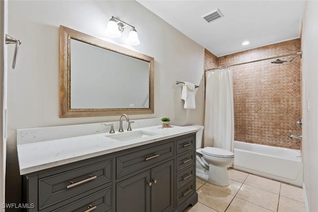 full bathroom featuring tile patterned flooring, shower / bath combo, vanity, and toilet