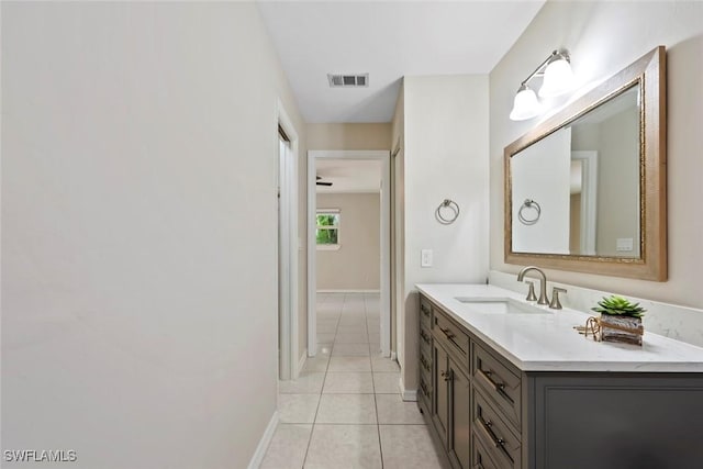 bathroom with tile patterned floors and vanity