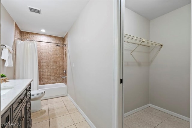 full bathroom with tile patterned flooring, vanity, toilet, and shower / bath combo with shower curtain