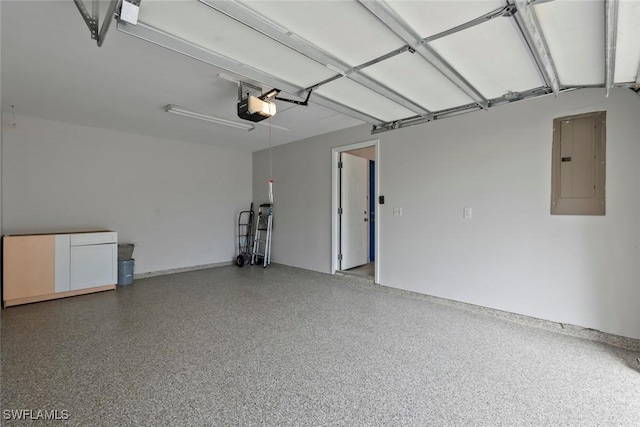 garage featuring electric panel and a garage door opener