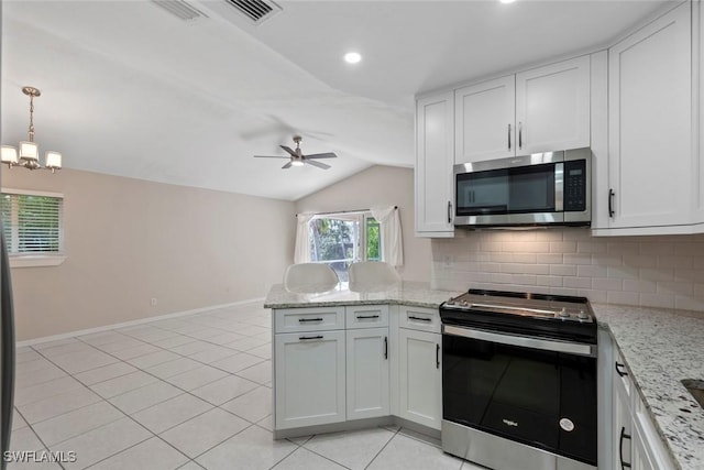 kitchen featuring white cabinets, lofted ceiling, and appliances with stainless steel finishes