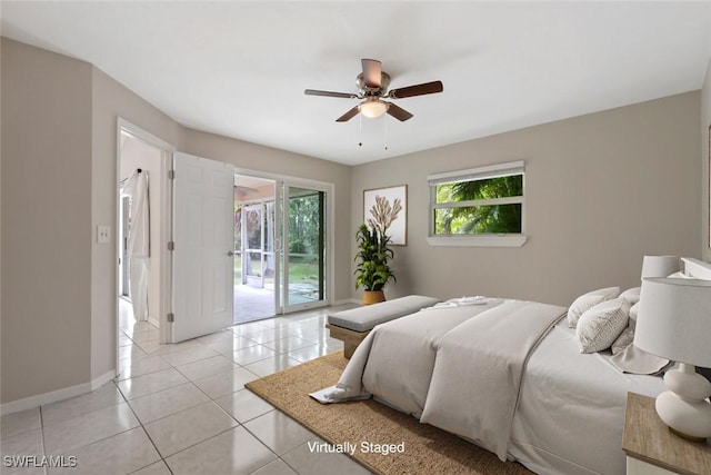 bedroom with ceiling fan, light tile patterned flooring, and access to outside