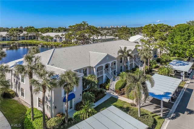 birds eye view of property featuring a water view