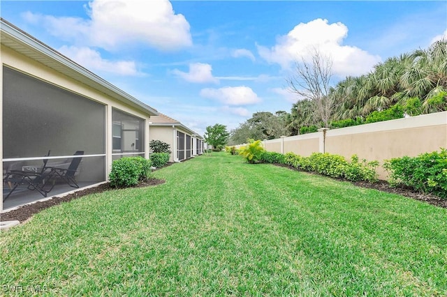 view of yard featuring a sunroom