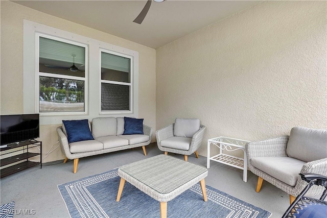 view of patio featuring ceiling fan