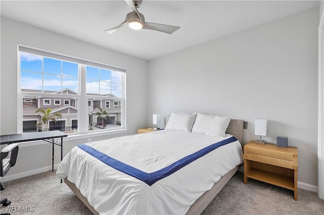 bedroom with ceiling fan and carpet floors