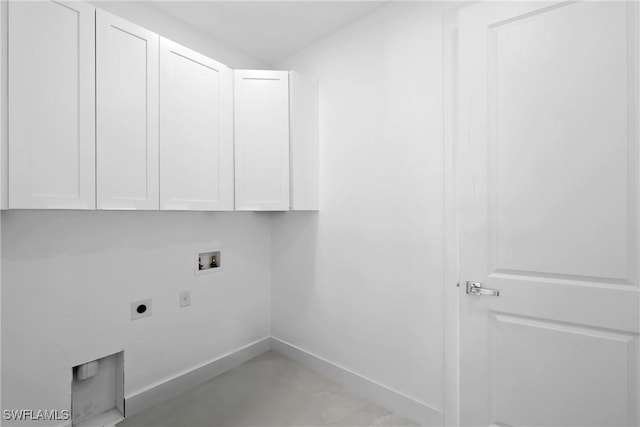 clothes washing area featuring cabinets, hookup for a washing machine, and electric dryer hookup