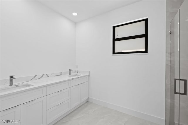 bathroom featuring vanity and walk in shower