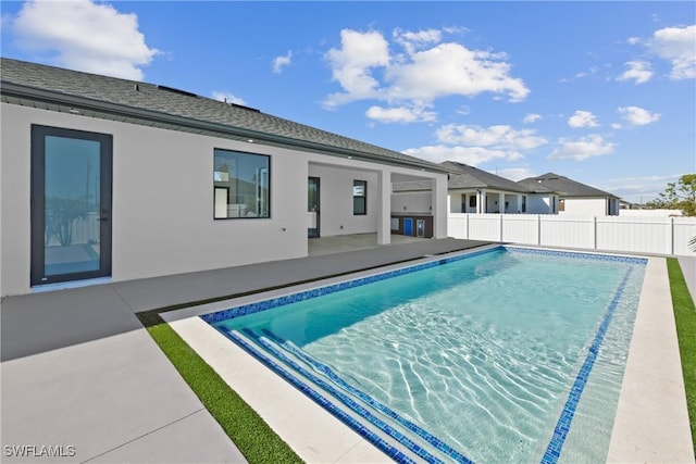 view of swimming pool featuring a patio