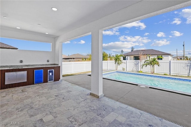 view of pool featuring a patio