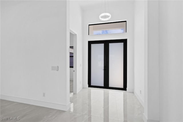 foyer entrance featuring french doors