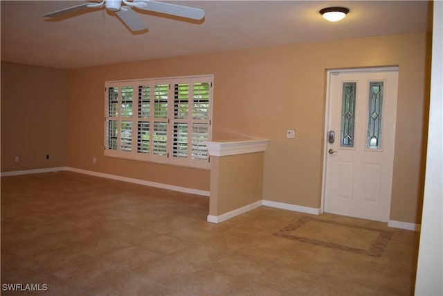 foyer entrance with ceiling fan