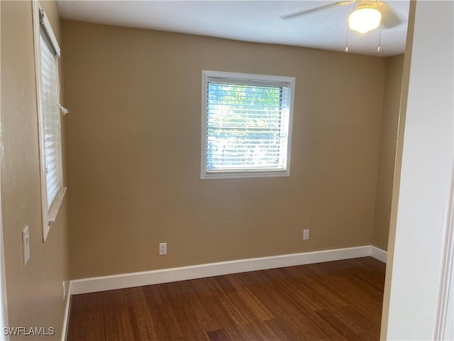 empty room with ceiling fan and hardwood / wood-style flooring