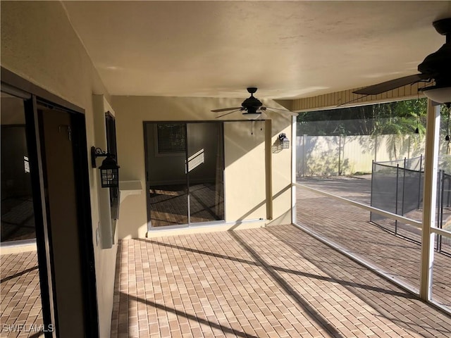 exterior space with ceiling fan