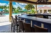 view of patio / terrace featuring an outdoor bar