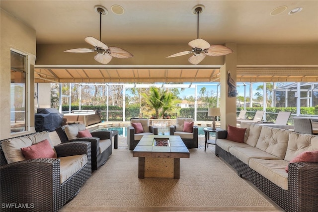 sunroom featuring ceiling fan