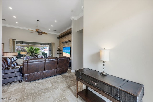 living room featuring ceiling fan and ornamental molding