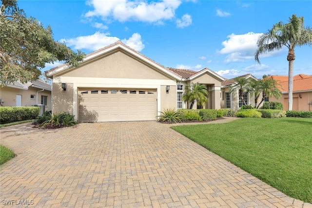 ranch-style house featuring a front yard and a garage