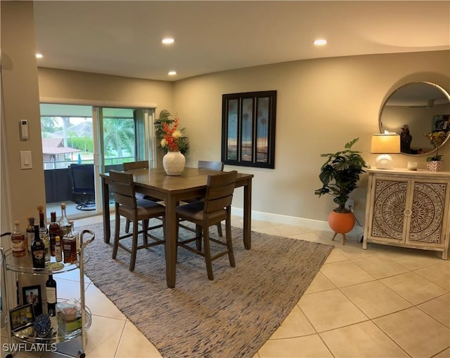 dining room with light tile patterned flooring