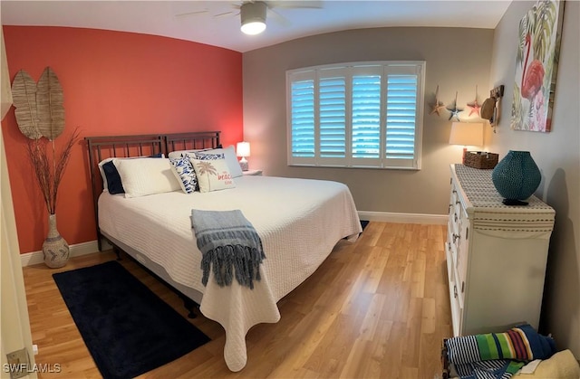 bedroom with ceiling fan and light hardwood / wood-style flooring