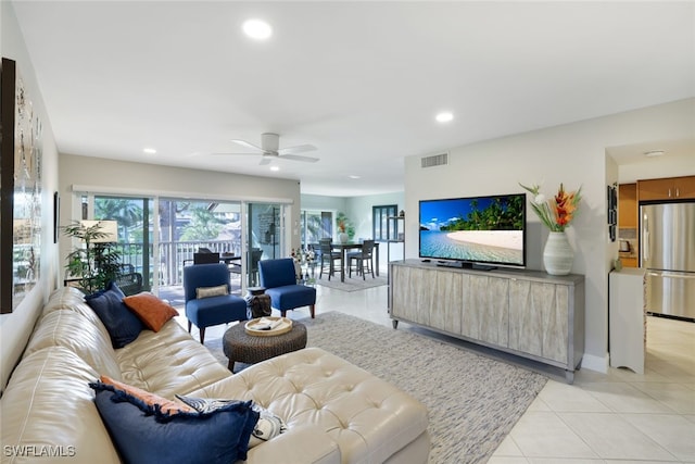 living room with ceiling fan and light tile patterned floors