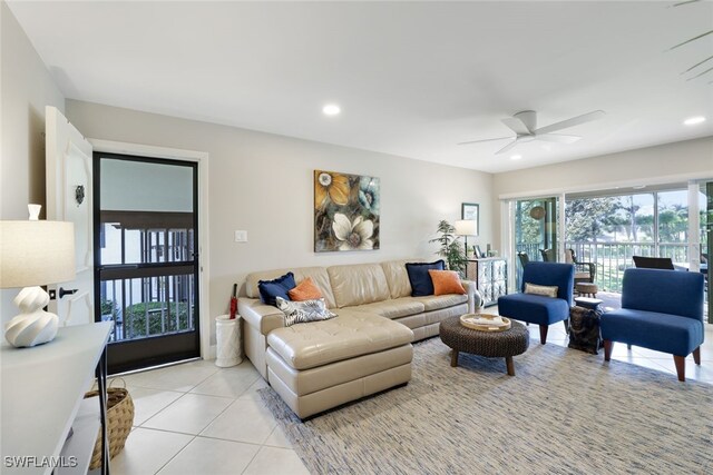 tiled living room featuring ceiling fan