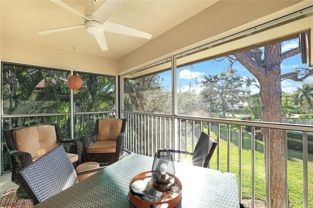 sunroom featuring ceiling fan