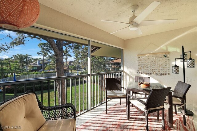 exterior space with ceiling fan