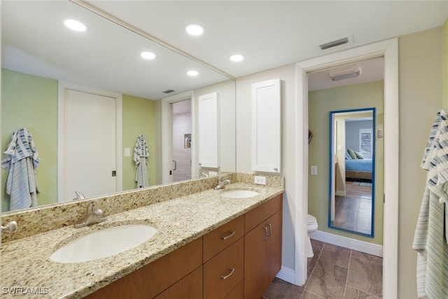 bathroom with vanity and toilet