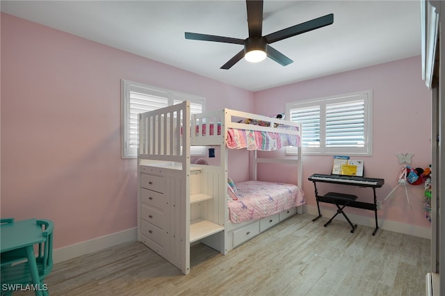 bedroom featuring light hardwood / wood-style flooring and ceiling fan