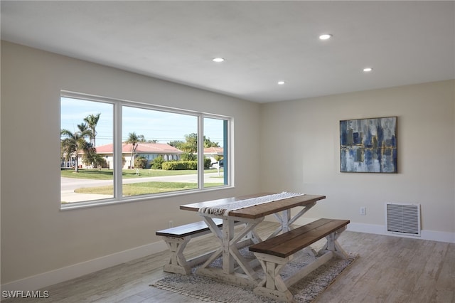 dining area with light hardwood / wood-style flooring and plenty of natural light