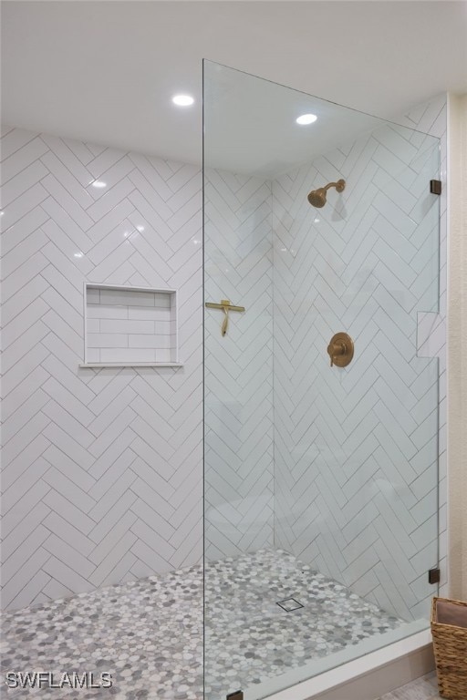 bathroom with a tile shower