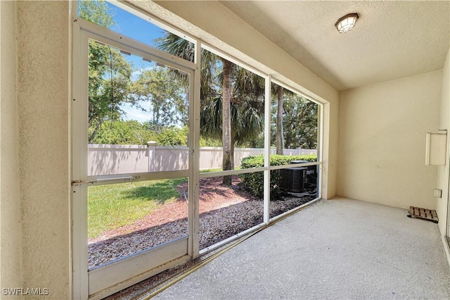 unfurnished sunroom with plenty of natural light