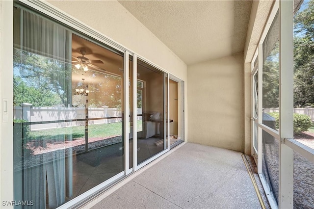 unfurnished sunroom featuring an inviting chandelier