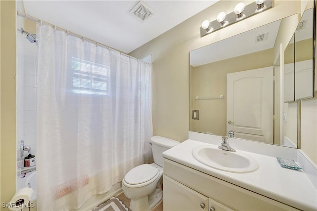 full bathroom with shower / bath combination with curtain, toilet, and vanity