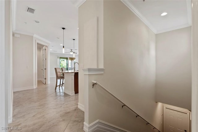 staircase with crown molding