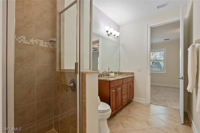 bathroom with an enclosed shower, ornamental molding, vanity, tile patterned flooring, and toilet