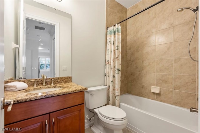 full bathroom featuring shower / bath combination with curtain, toilet, and vanity