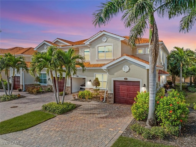 mediterranean / spanish-style house featuring a garage