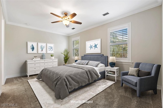 carpeted bedroom with ceiling fan and crown molding