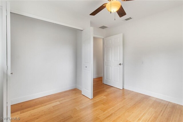 empty room with light hardwood / wood-style floors and ceiling fan