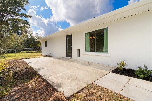 back of house with a patio area