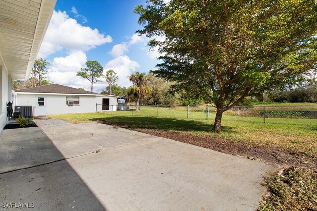 view of yard with a patio area and central AC