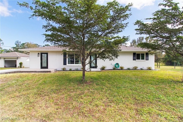 ranch-style house with a front lawn