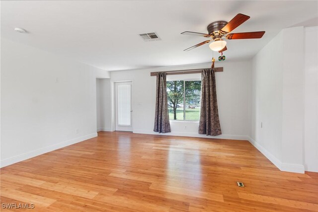 unfurnished room with ceiling fan and light hardwood / wood-style flooring