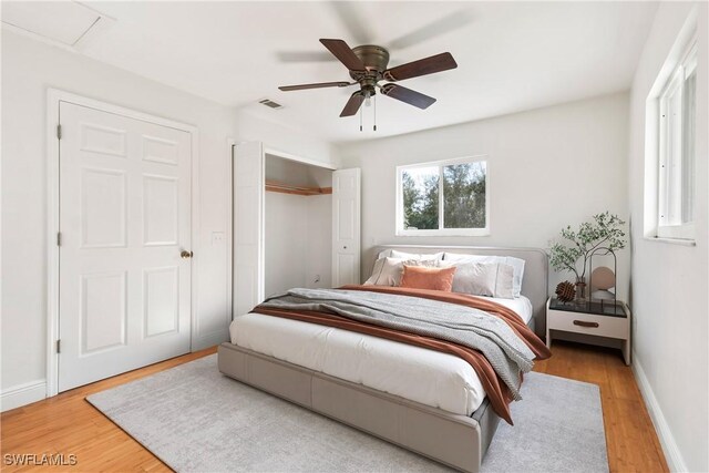 bedroom featuring light hardwood / wood-style flooring and ceiling fan