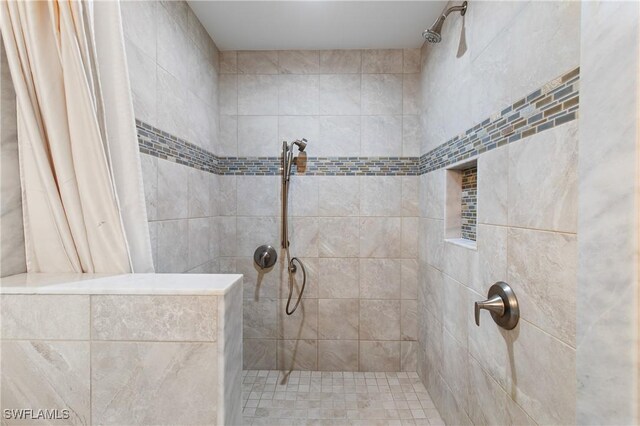 bathroom featuring a shower with curtain