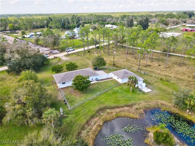 aerial view featuring a rural view and a water view