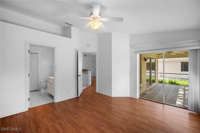 empty room with light wood-type flooring and ceiling fan