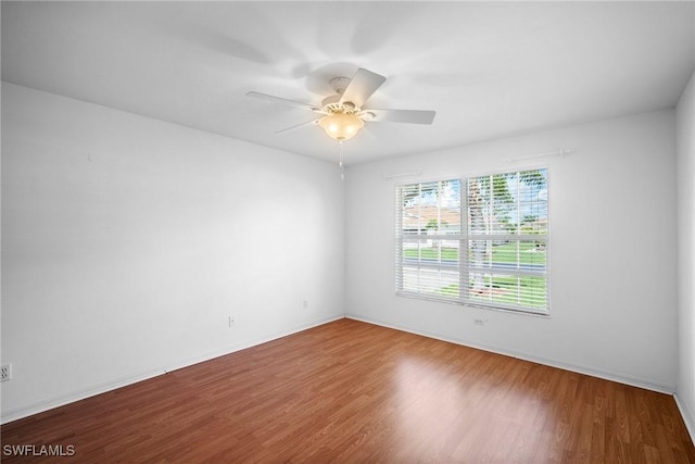 spare room featuring ceiling fan and wood-type flooring